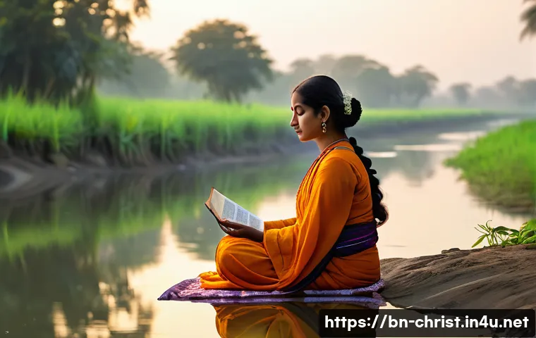 기독교와 하나님 중심 삶 - A serene Bengali woman in modest traditional attire, sitting peacefully by a riverside at dawn, enga...